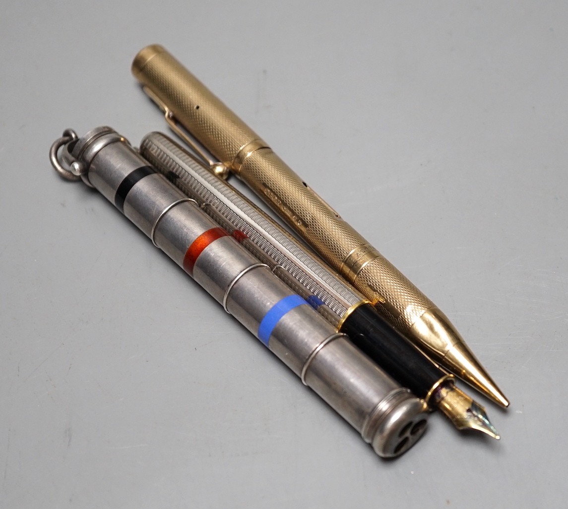 A 9ct yellow gold double ended Asprey pencil and fountain pen, a multi-colour propelling pen and one other (3)